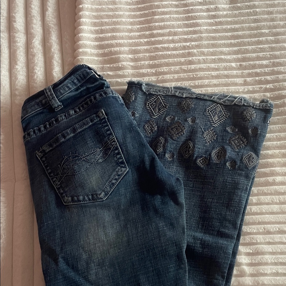 Woman’s cowgirl tuff jeans, trouser style, small stain near the pocket